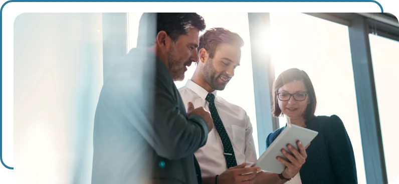 Three business people discussing a proposal Three business people discussing a proposal